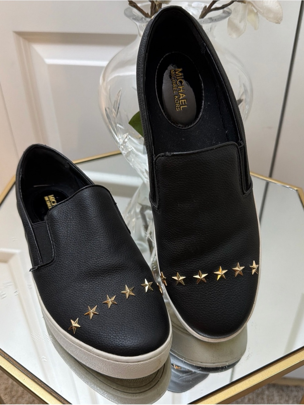 Michael Kors Black Slip-On Sneakers with Gold Star Accents